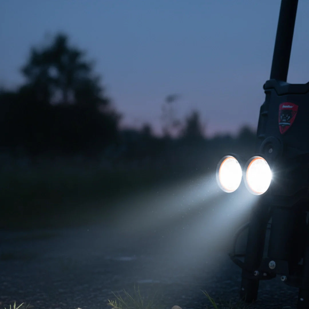 Electric scooter Kaabo Wolf King GTR MAX – headlights illuminated at dusk