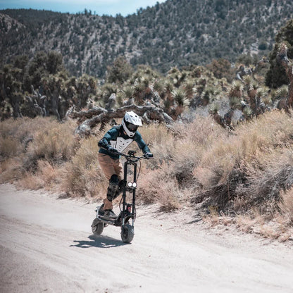 Electric scooter Kaabo Wolf Warrior 11 MAX – rider on dirt track