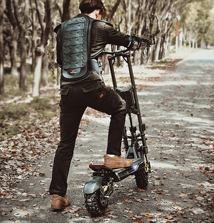 Electric scooter Langfeite H1 2026 – rear view, rider on forest path