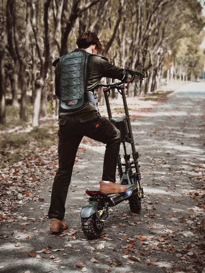 Electric scooter Langfeite H1 2026 – rider with back protector on path