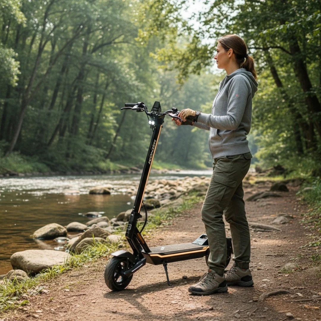 Electric scooter MS Energy Flare – woman with scooter by river