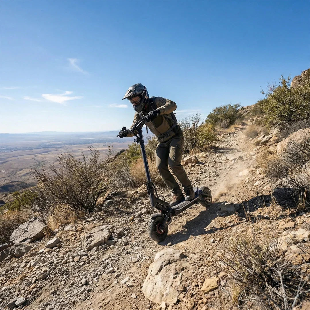 Electric scooter Teverun Fighter Mini PRO 2026 – rider on dry mountain trail