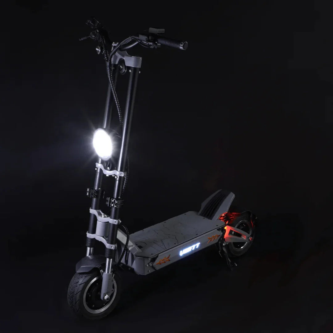 Electric scooter VSETT 11+ – front three-quarter view, lights on