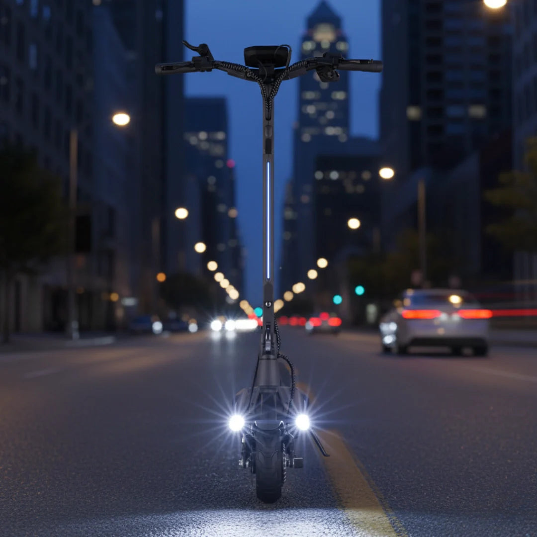 Electric scooter VSETT 9 APEX – front view, headlights on city street