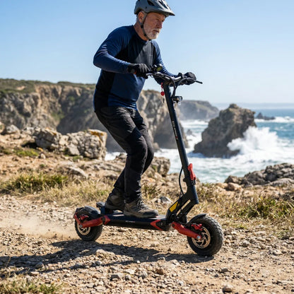 Electric scooter ECO Speed 9X – man riding on rocky coastal path