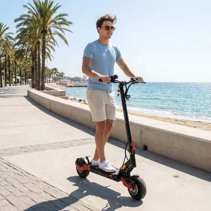 Electric scooter ECO Speed 9X – man riding on beach promenade