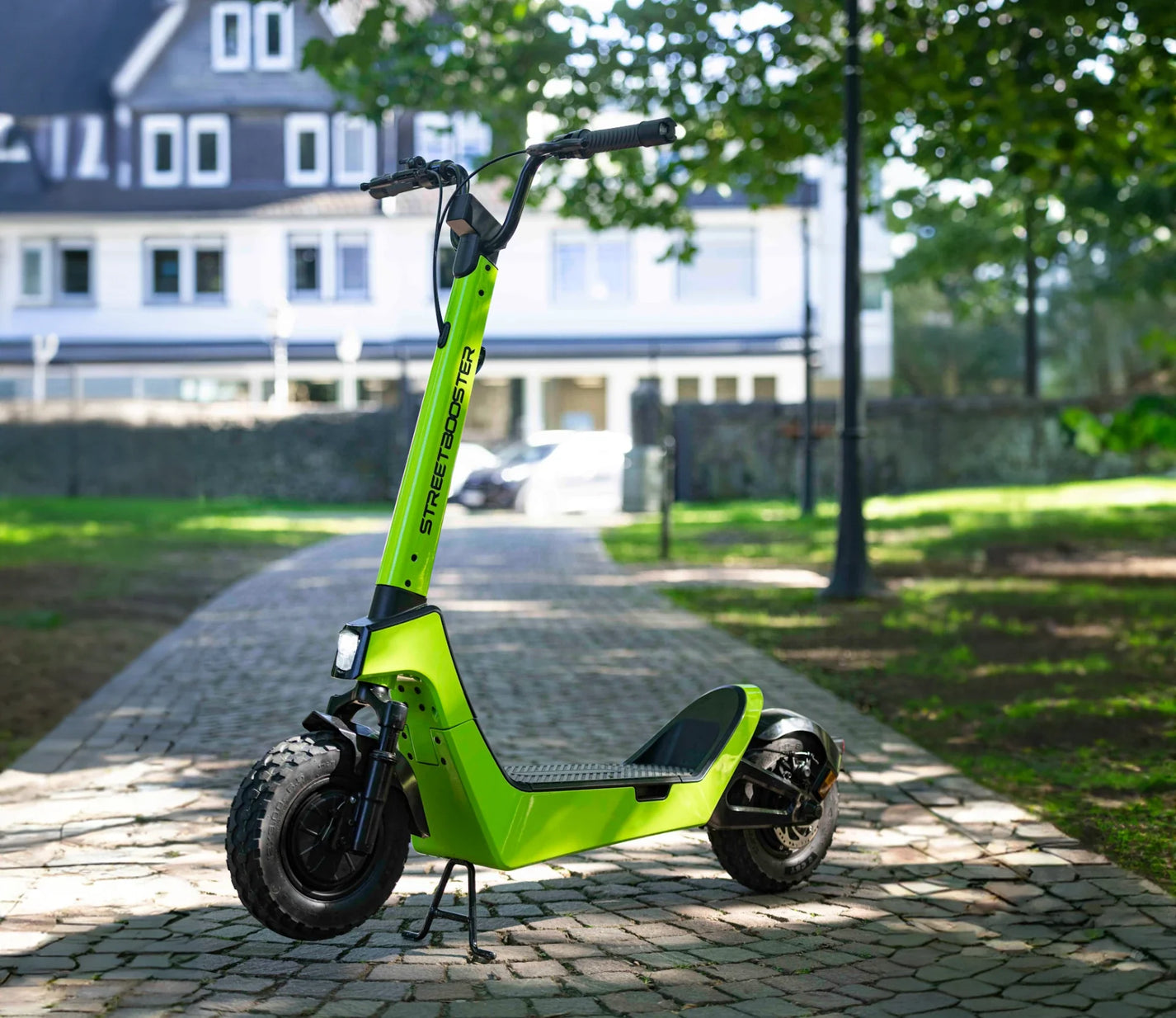 Electric scooter StreetBooster Castor – front three-quarter view, lime green