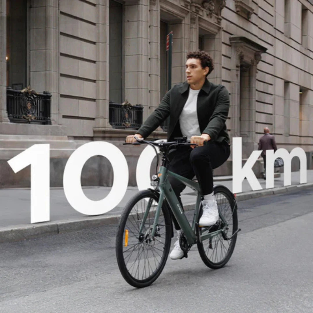 Electric bicycle Engwe MapFour N1 AIR – rider on street with 100km graphic
