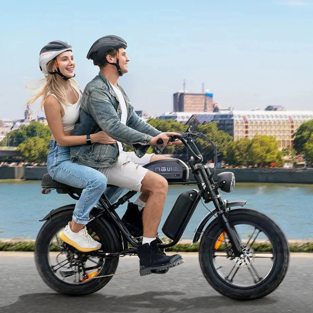 Electric bicycle Engwe M1 – couple riding along a river
