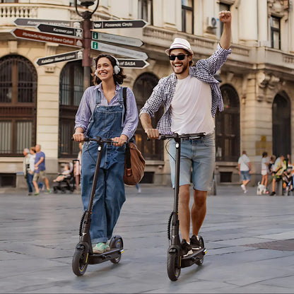 Electric Scooter Engwe Y10, stylish and portable, modeled by two happy riders in a vibrant city setting.