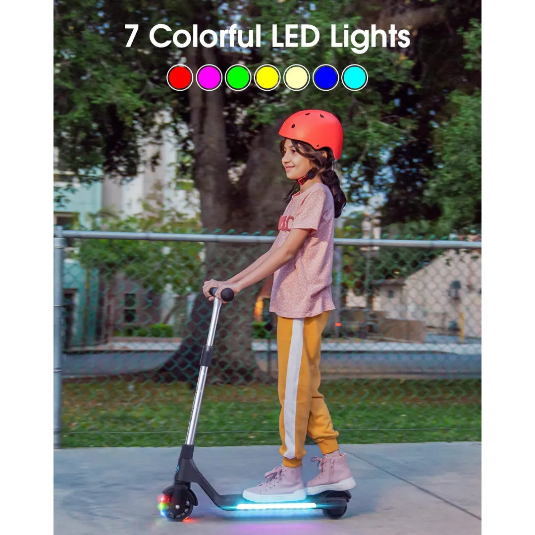 The child rides the Gyroor H30 electric scooter, which displays 7 colorful LED lights