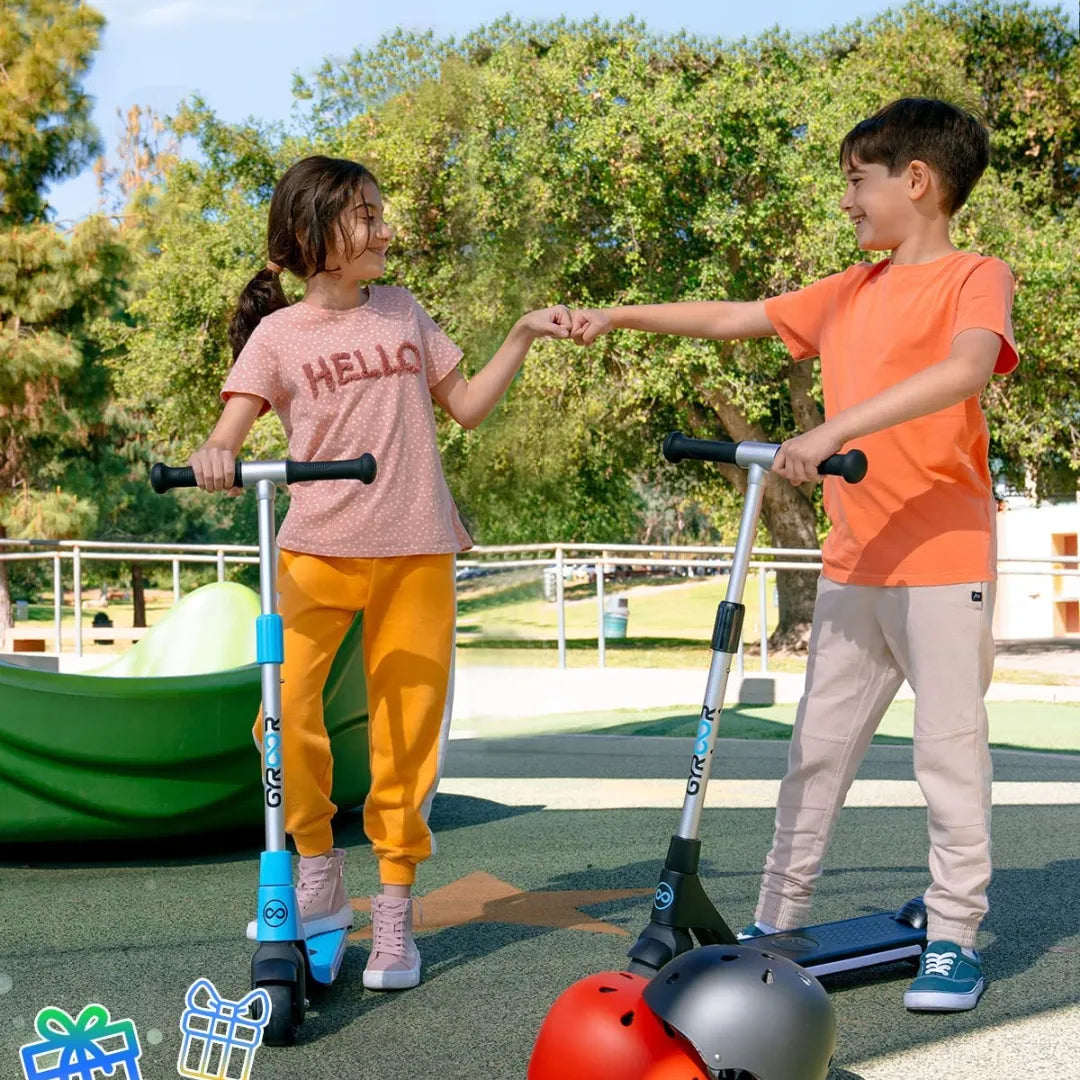 Two kids share a playful moment on the Gyroor H30s electric scooter in the park