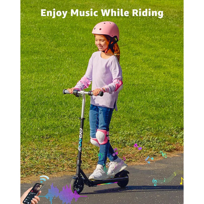 Electric Scooter Gyroor H30 Max, child riding scooter wearing a pink helmet and knee pads, outdoor setting.