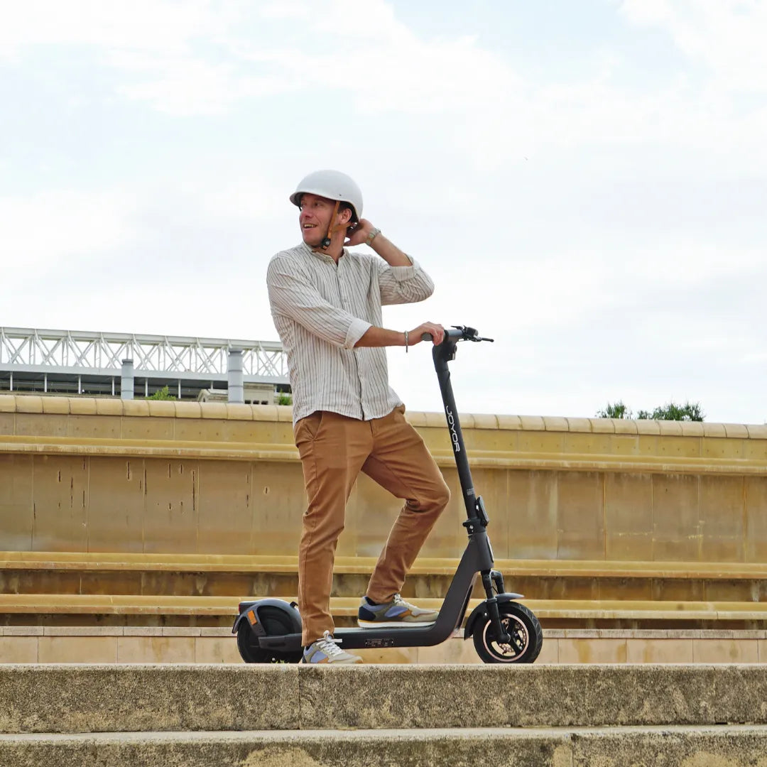 Electric scooter Joyor LiteGo – man riding in urban setting
