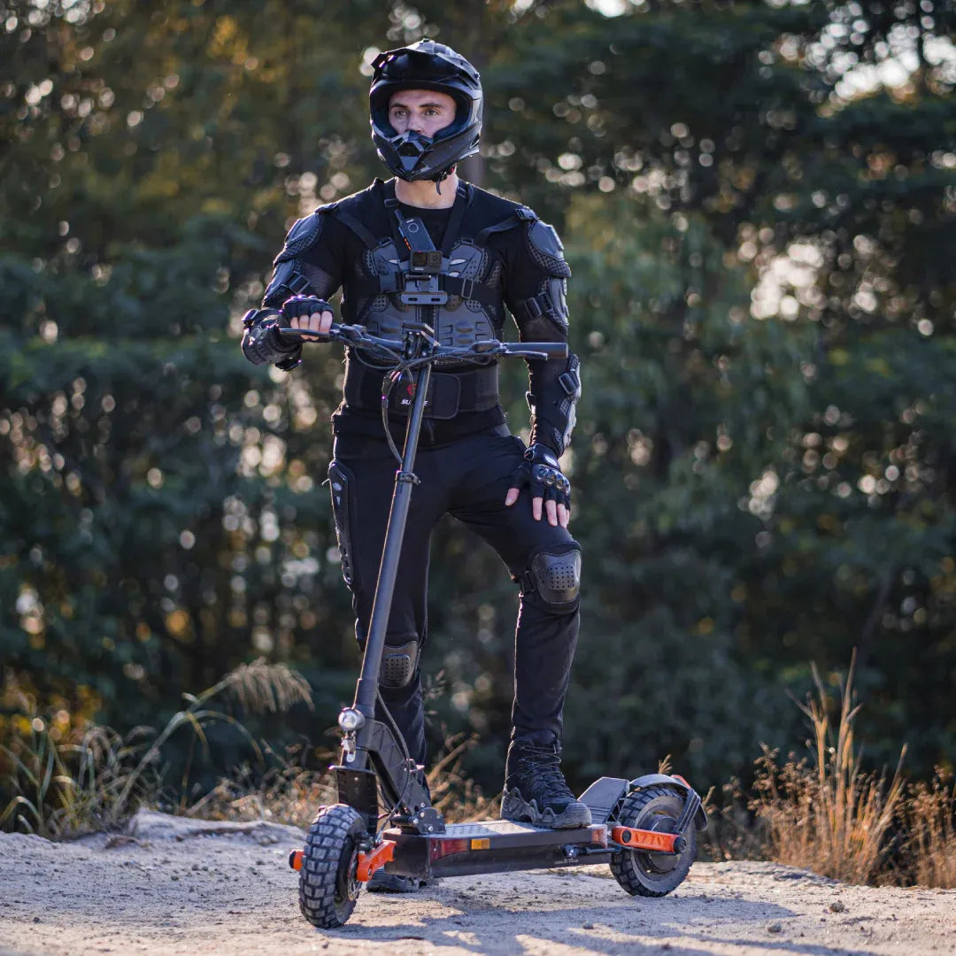 Electric scooter Joyor S10-S-Z – rider on dirt path, full gear