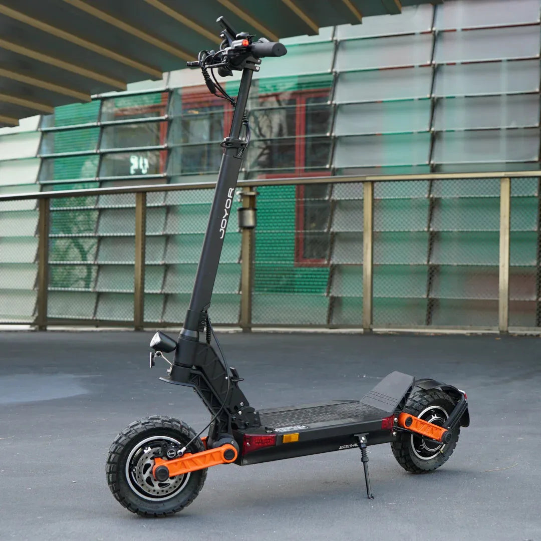 Electric scooter Joyor S10-S-Z – side view, urban background