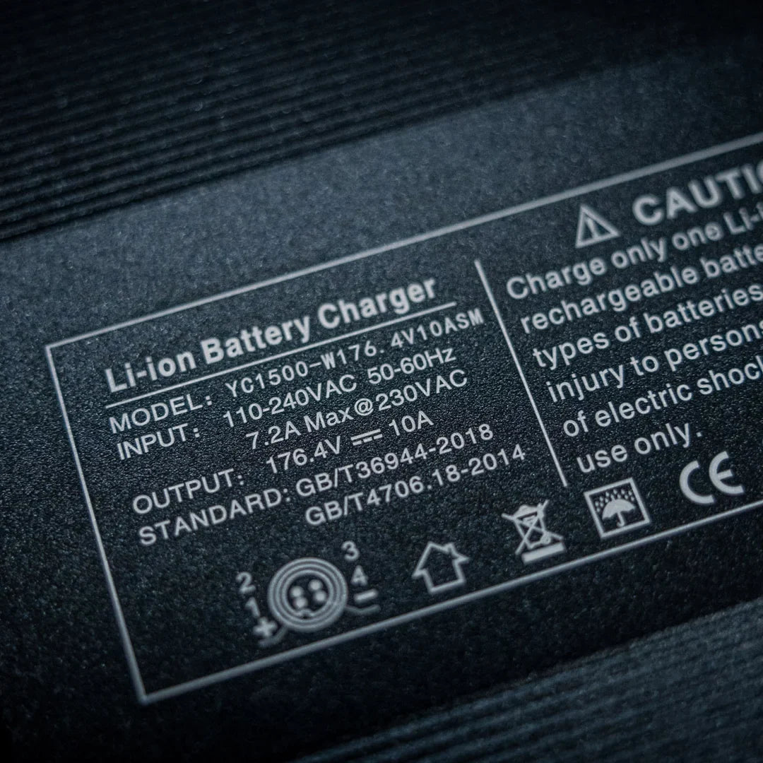 Electric Unicycle Kingsong F22 Pro, features a Li-ion battery charger with model and safety specifications.