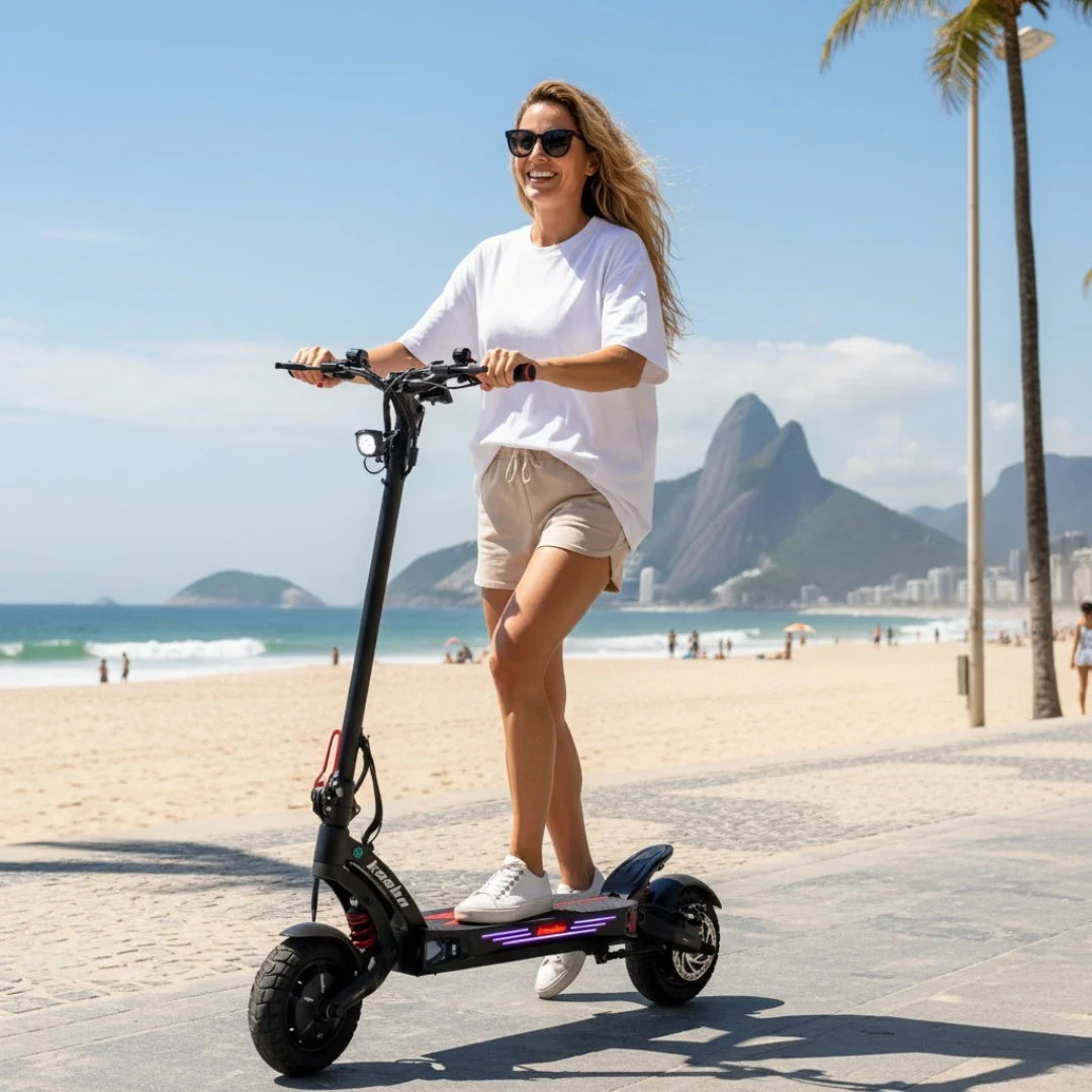 Electric scooter Kaabo Mantis King GT – woman riding on beach promenade