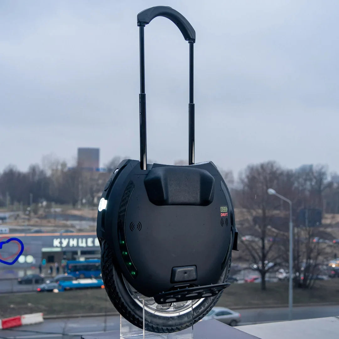 Electric Unicycle Kingsong 18xl features a sleek design with a built-in handle, durable wheel, and LED indicators.