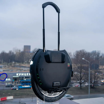 Electric Unicycle Kingsong 18xl features a sleek design with a built-in handle, durable wheel, and LED indicators.