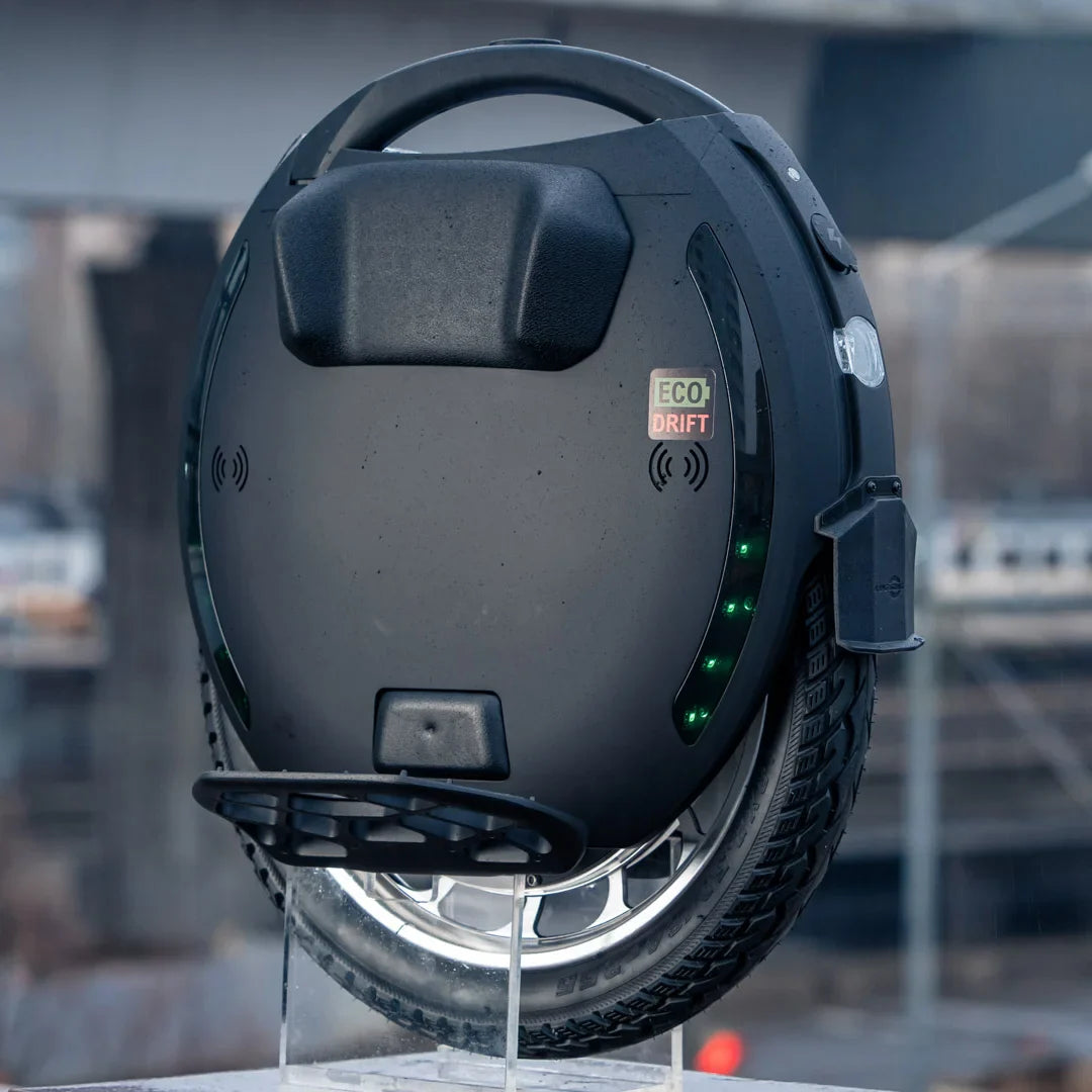 Electric Unicycle Kingsong 18xl features a sleek black design, illuminated indicators, and sturdy tire.