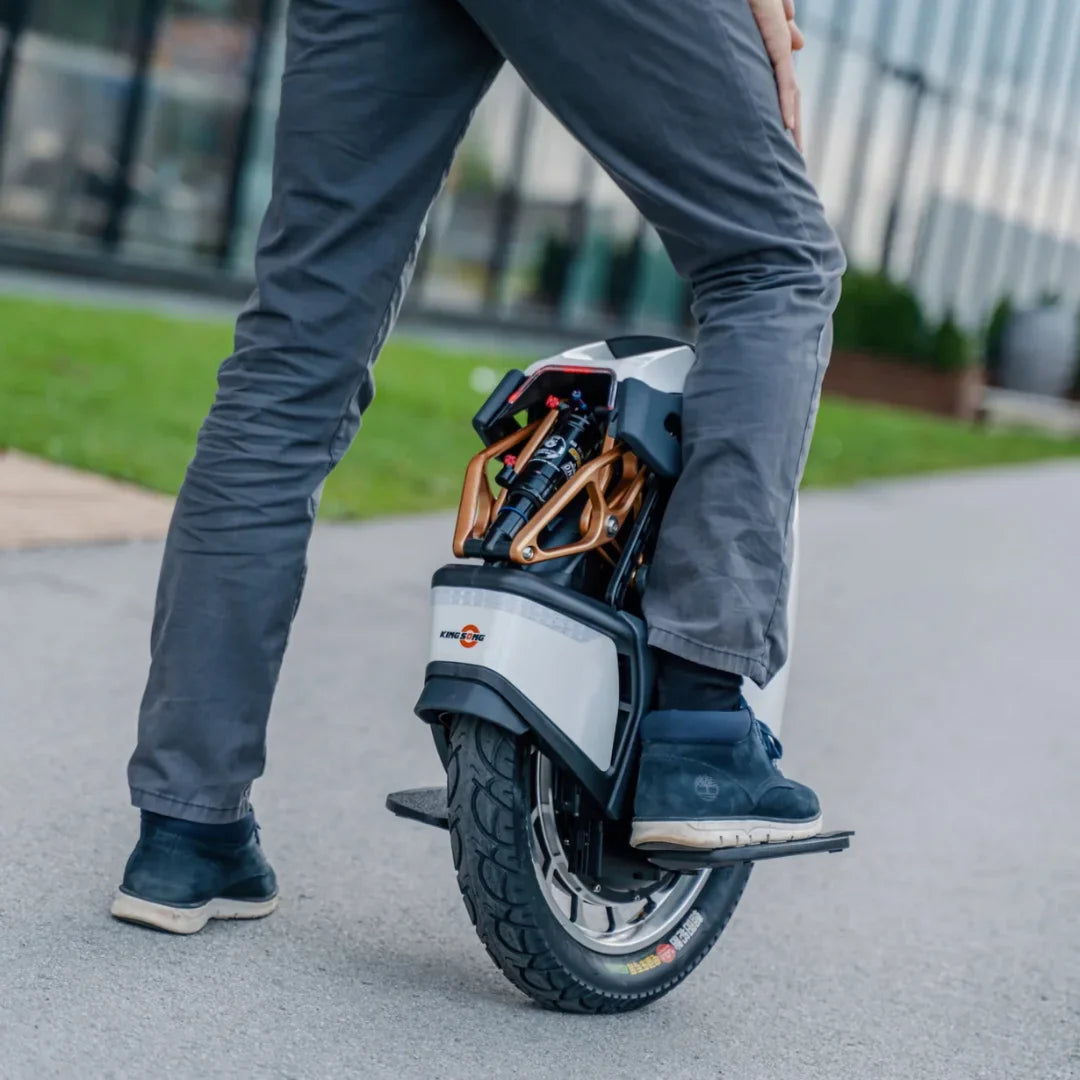 Electric unicycle KingSong S18 Pro+ – rider on unicycle, side view