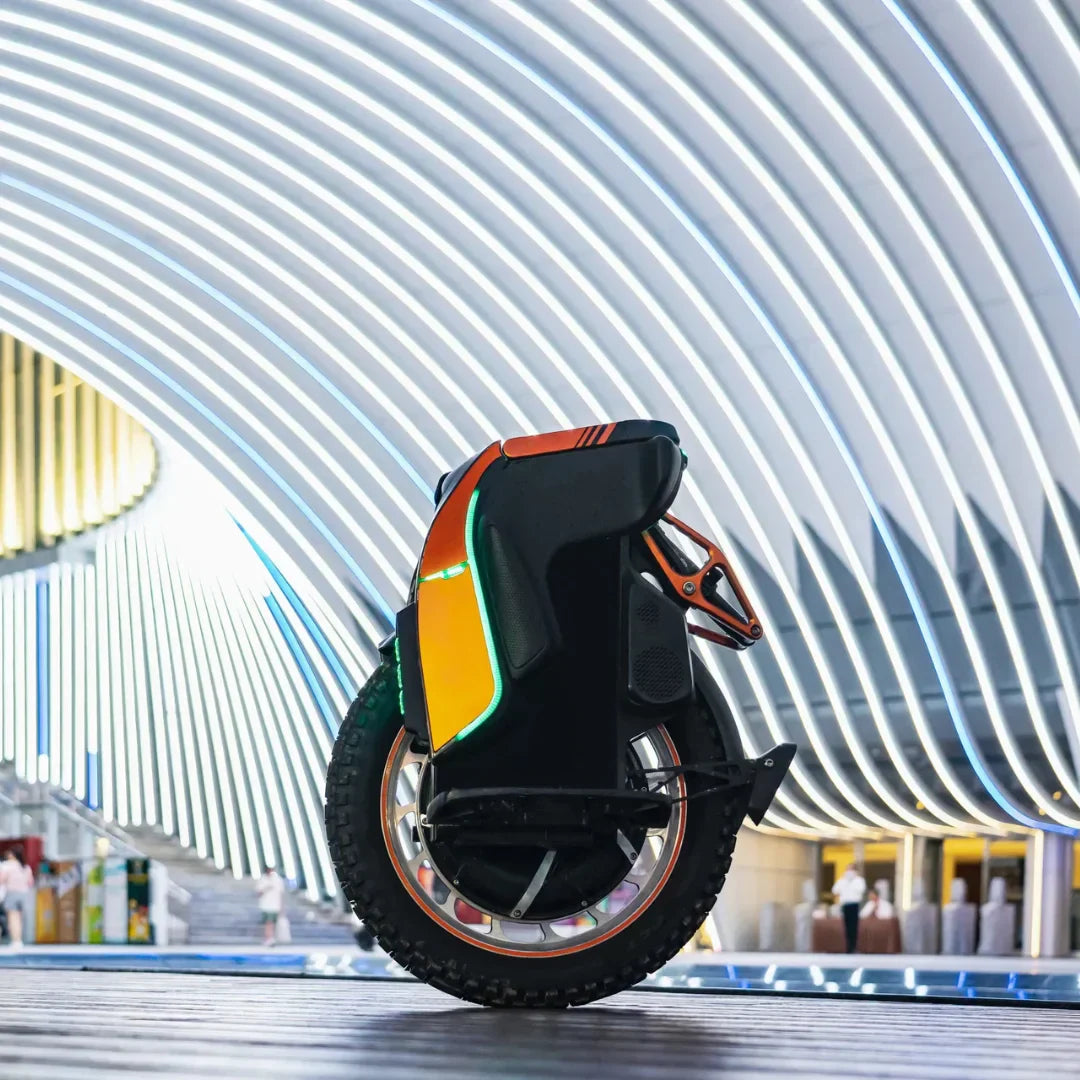 Electric unicycle KingSong S19 – side view, modern building background