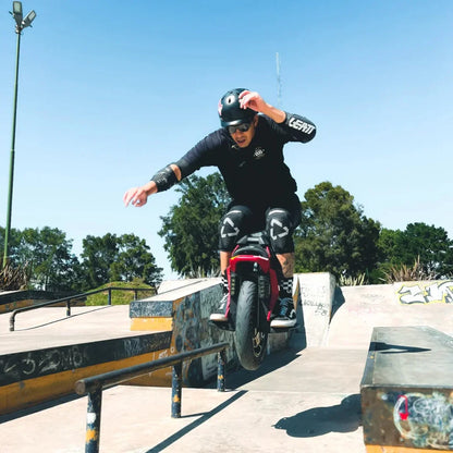 Electric Unicycle Kingsong S22 Pro, a rider performs tricks at a skate park, showcasing agility and style.