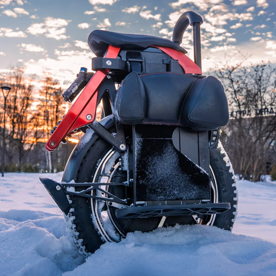 Electric unicycle KingSong S22 Pro+ – rear view in snow, sunset background