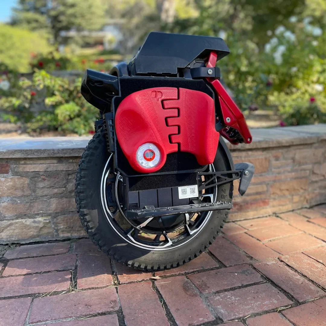 Electric unicycle KingSong S22 Pro+ – red body, side view, outdoor setting