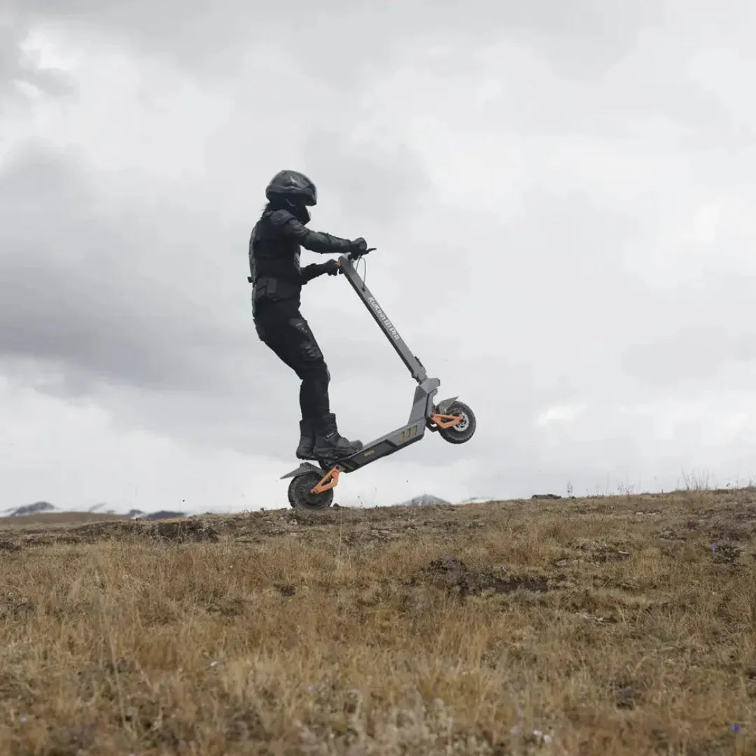Electric Scooter Kukirin G1 Pro, rugged design, rider performing a stunt on uneven terrain, dynamic action shot.