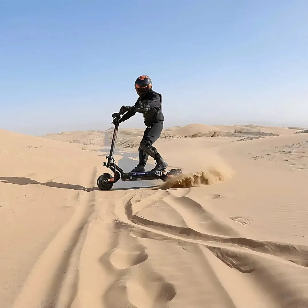 Electric scooter KuKirin G2 Master 2025 – rider on sand dunes