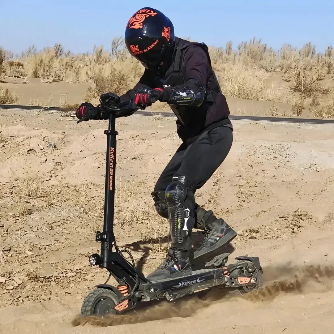 Electric scooter KuKirin G2 Master 2025 – rider on scooter in sand