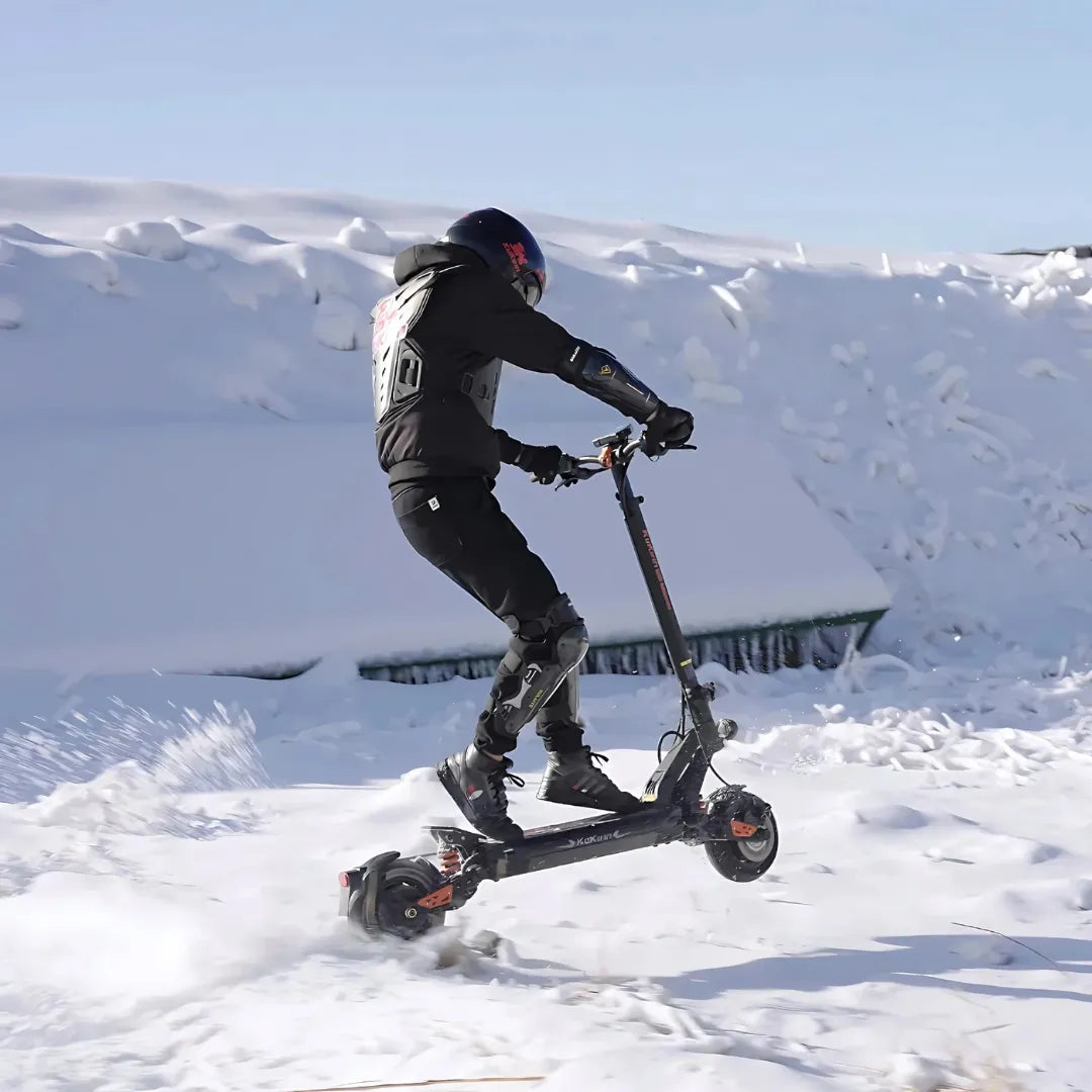 Electric scooter KuKirin G2 Master 2025 – rider jumping scooter in snow