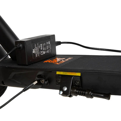 A close-up view of the charging connector for the Kukirin S1 Max electric scooter with the charger connected