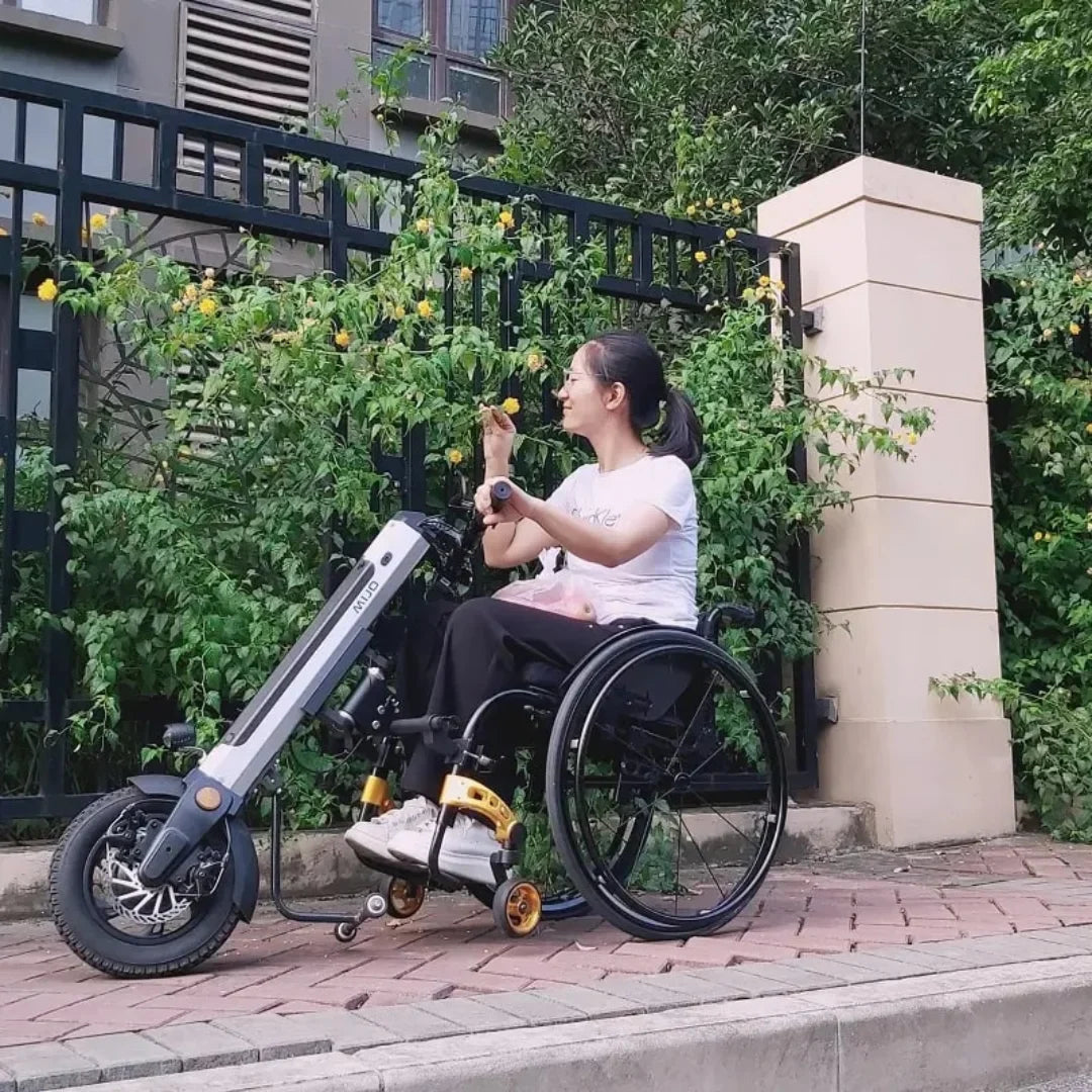 Electric Handbike Mijo Mt03, a compact and modern electric bike attachment for wheelchairs, enhances mobility.