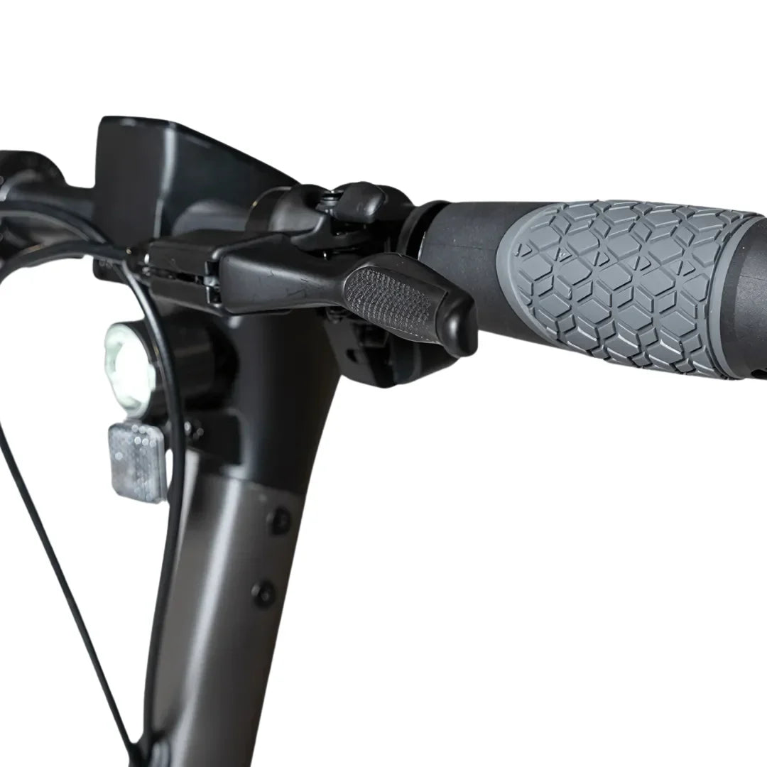Electric Scooter Ms Energy Mentor features a sleek handlebar with a textured grip, brake lever, and LED light.
