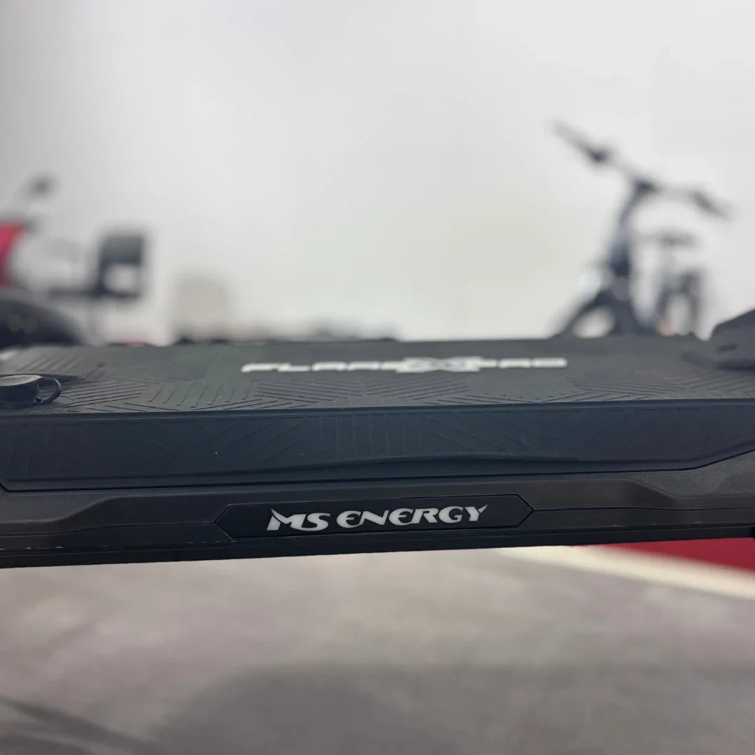 Electric Scooter Ms Energy Flare X Pro features a sleek, textured deck with a prominent logo for grip and style.