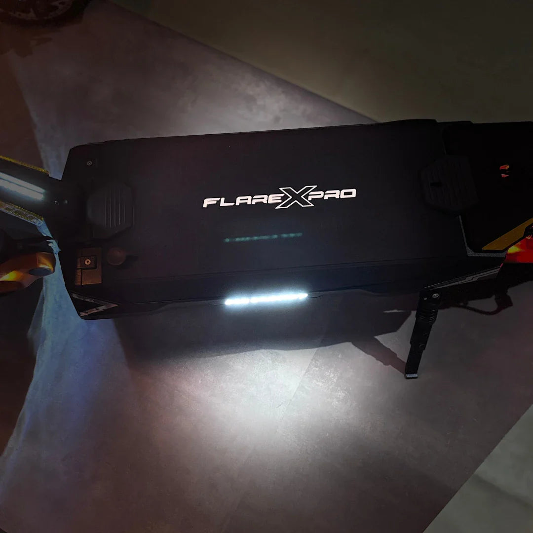 Electric Scooter Ms Energy Flare X Pro features a sleek black design with illuminated branding, ideal for night rides.