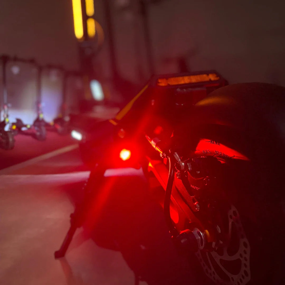 Electric Scooter Ms Energy Flare X Pro features a sleek design with vibrant red LED lights, perfect for night rides.