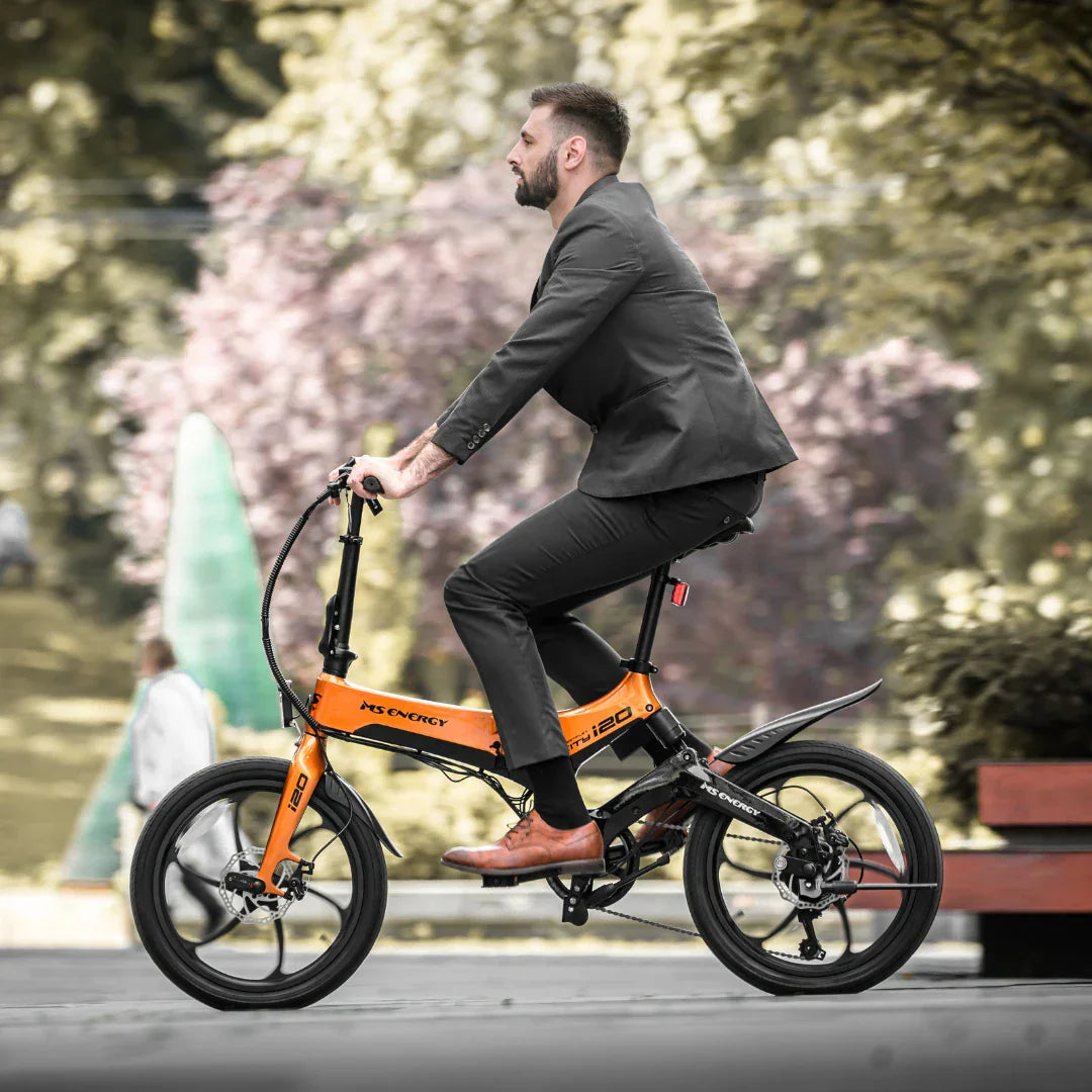 Electric bicycle MS Energy StreetFlex i20 – man riding, side view, urban park