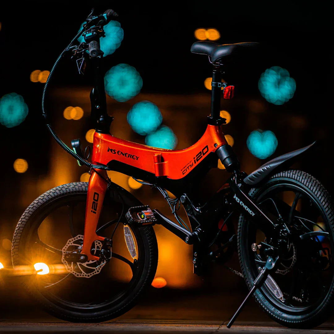 Electric bicycle MS Energy StreetFlex i20 – side view, dark background, orange bokeh