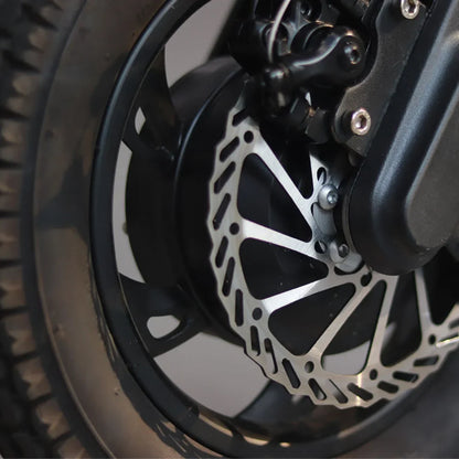 Electric Handbike Mijo Mt01 features a close-up view of its durable wheel and intricate braking system design.