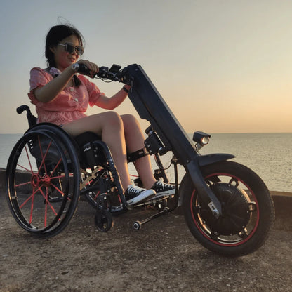 Electric Handbike Mijo Mt01, featuring a sleek design, enjoyed by a user by the waterfront at sunset.