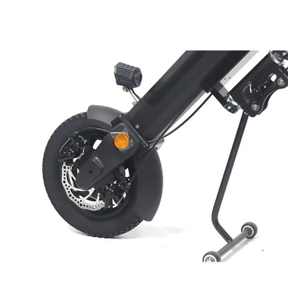 Electric Handbike Mijo Mt01 features a compact front wheel with disc brakes, a safety light, and a stable kickstand.