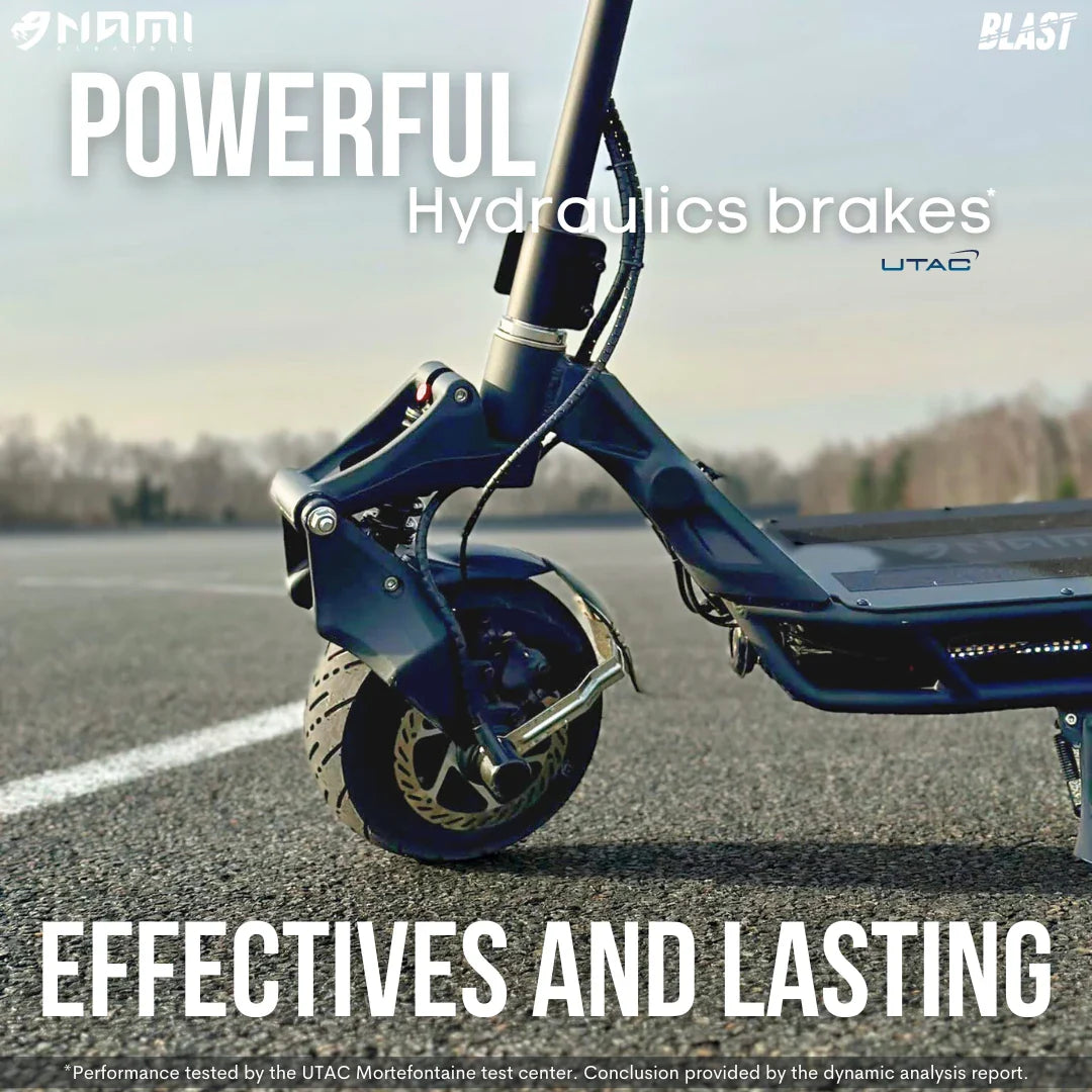 Close-up of the powerful hydraulic brakes on the electric scooter Nami Blast 2 Max, showcased on a road