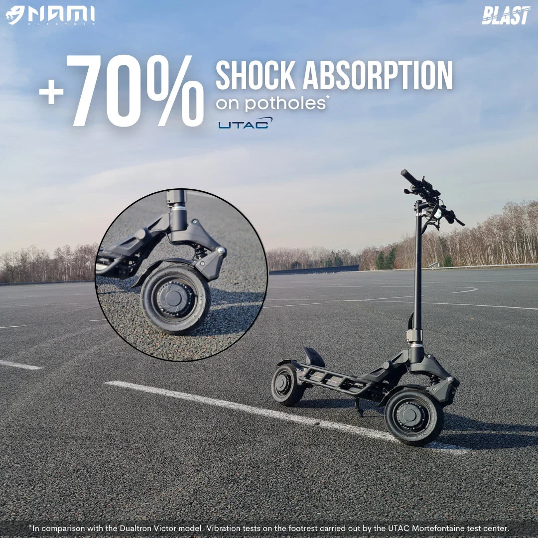 An electric scooter Nami Blast 2 Max showcasing its enhanced shock absorption feature, designed for better performance on potholes