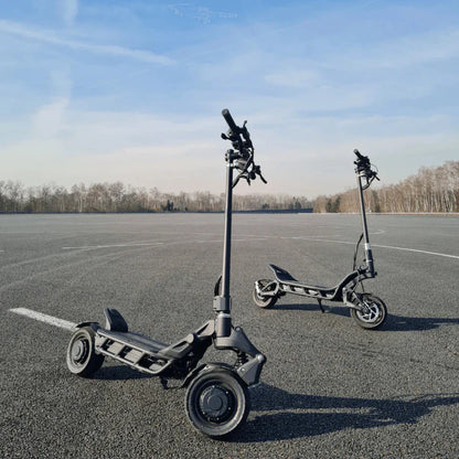 Electric Scooter Nami Blast Max features two robust scooters on a smooth asphalt surface, designed for performance.