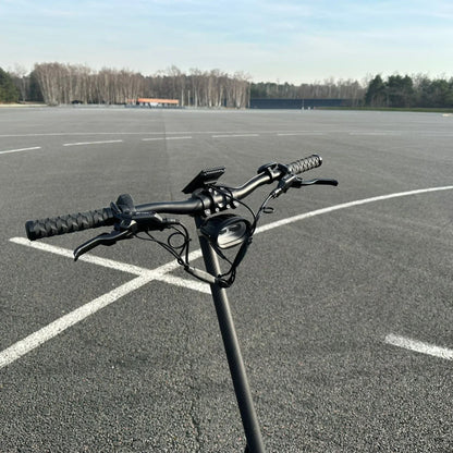 Electric Scooter Nami Burn E 3 features a sleek, modern design with an ergonomic handlebar for a smooth ride.