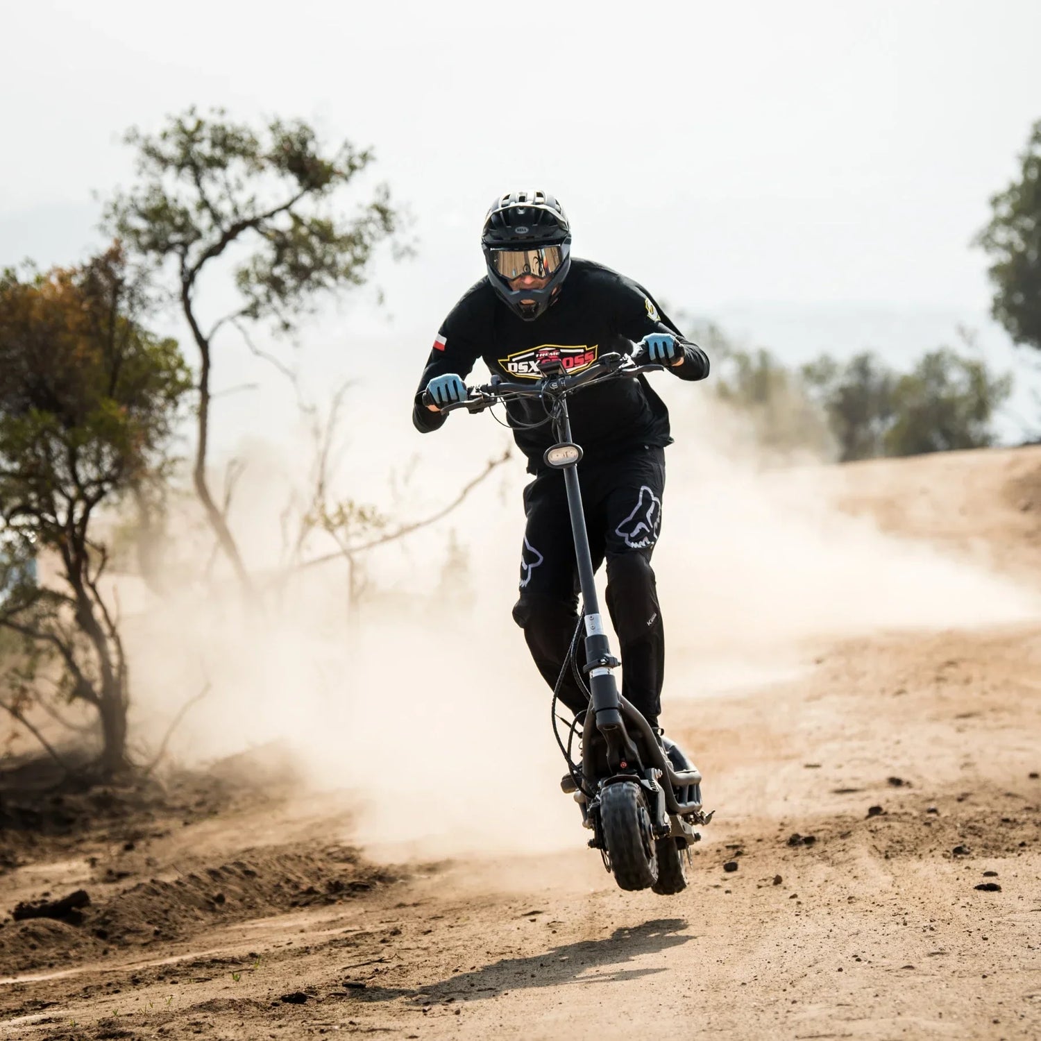 Electric Scooter Nami Burn E 3 Max, rugged design for off-road adventure, powerful performance in dusty terrain.
